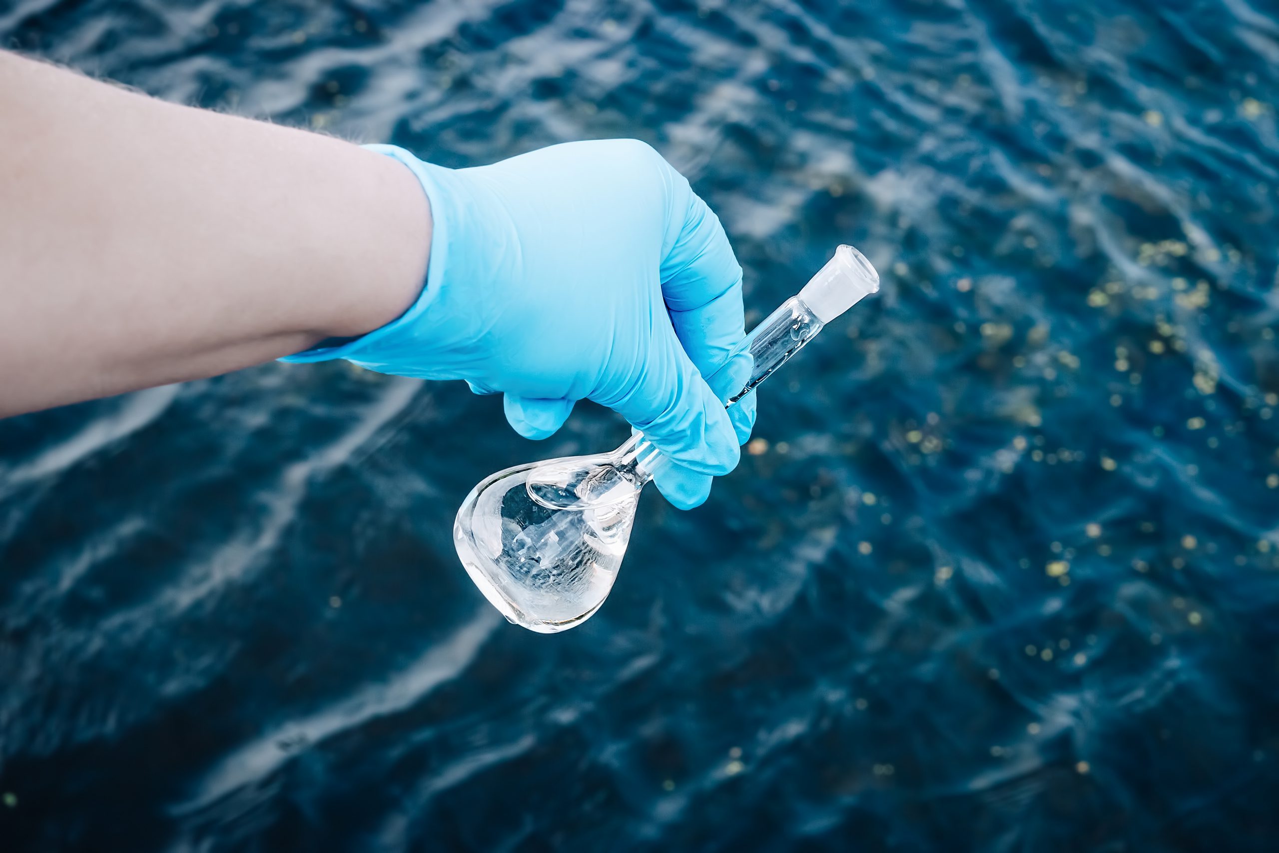 A water sample from the river. Water intake. Water abstraction. image